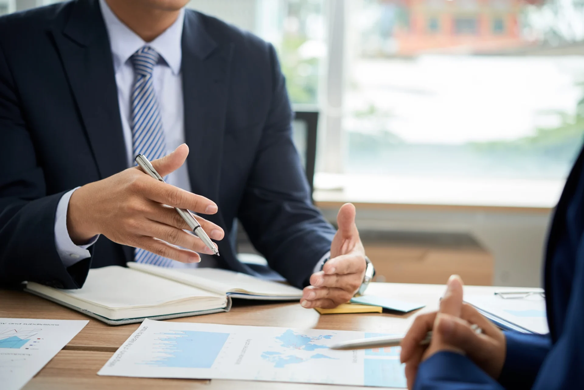 Business meeting with charts and notes